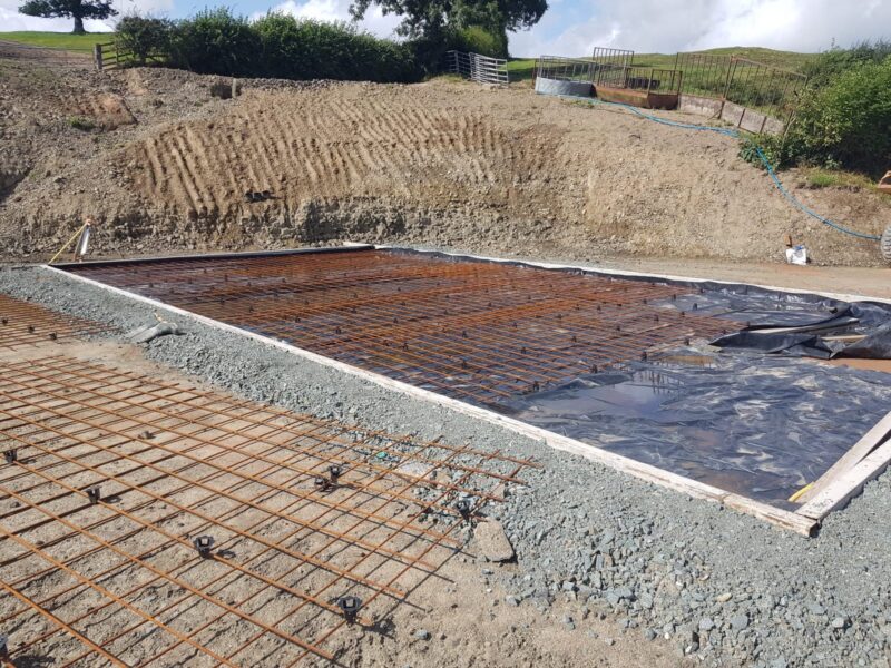 Reinforced concrete raft foundation with steel mesh laid out before the pour